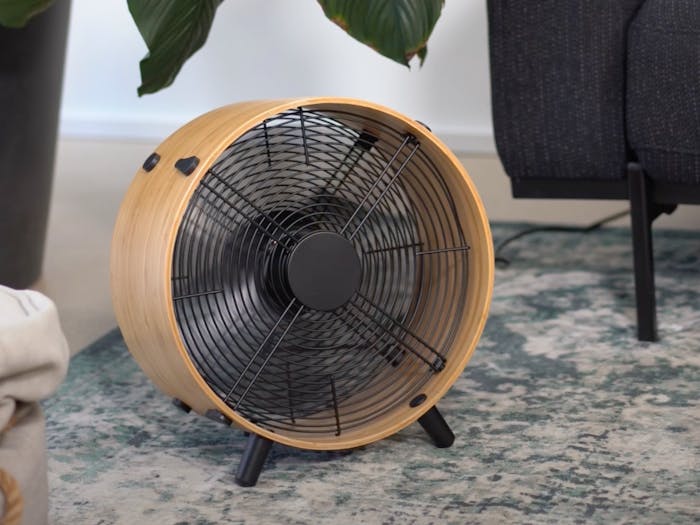 Otto bamboo fan by Stadler Form in a living room with carpet