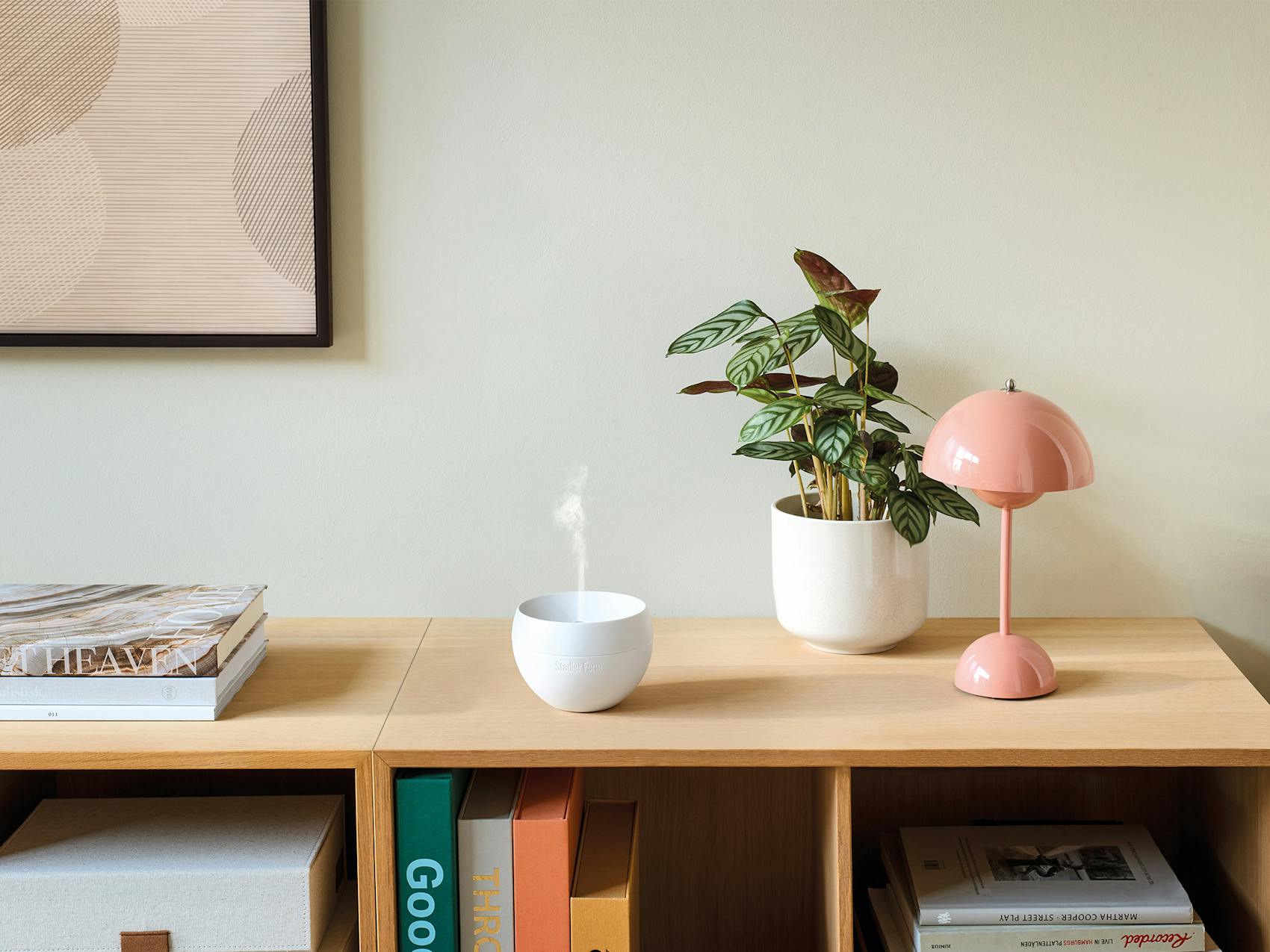 Jasmine mobile aroma diffuser in white on a sideboard