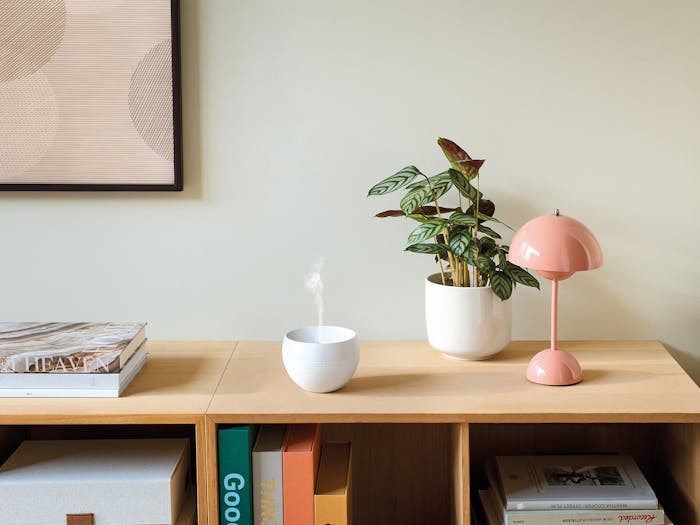 Jasmine mobile aroma diffuser in white on a sideboard