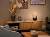 Aroma diffuser Sophie from Stadler Form in a living room Sophie aroma diffuser and lantern from Stadler Form on a sideboard