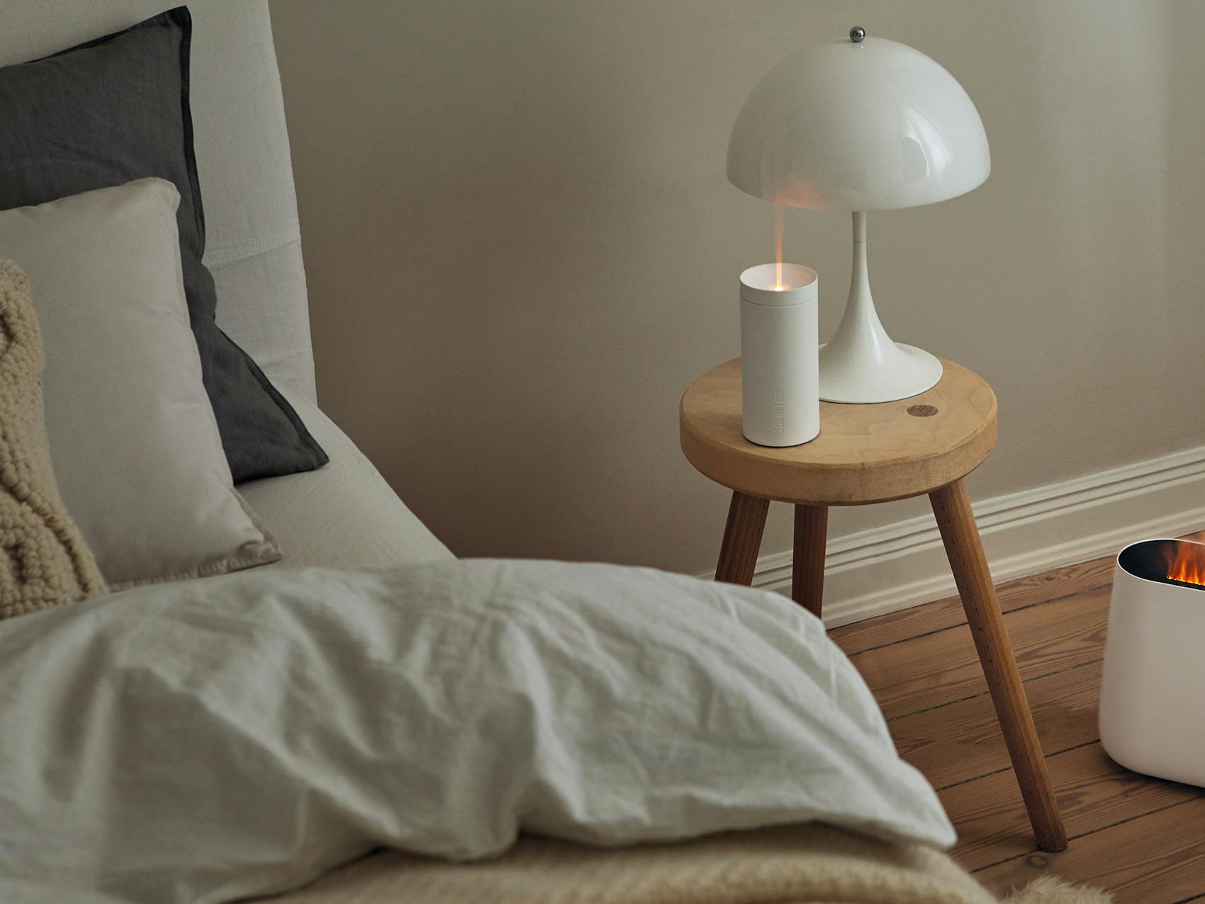 Lucy aroma diffuser by Stadler Form in white in a bedroom
