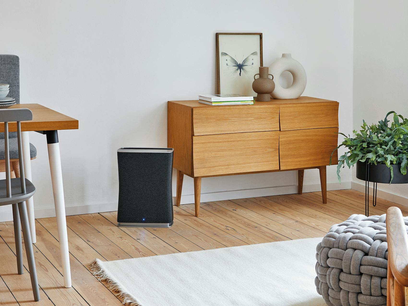 Roger little air purifier by Stadler Form in black Roger little air purifier by Stadler Form in black next to a sideboard
