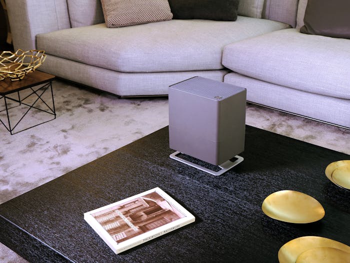 Oskar little humidifier by Stadler Form in titanium on a side table