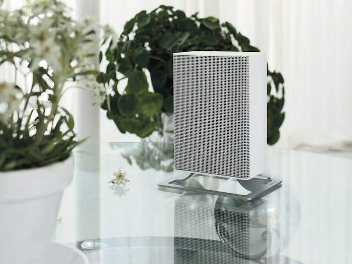 Anna little heater by Stadler Form in white on a glas table