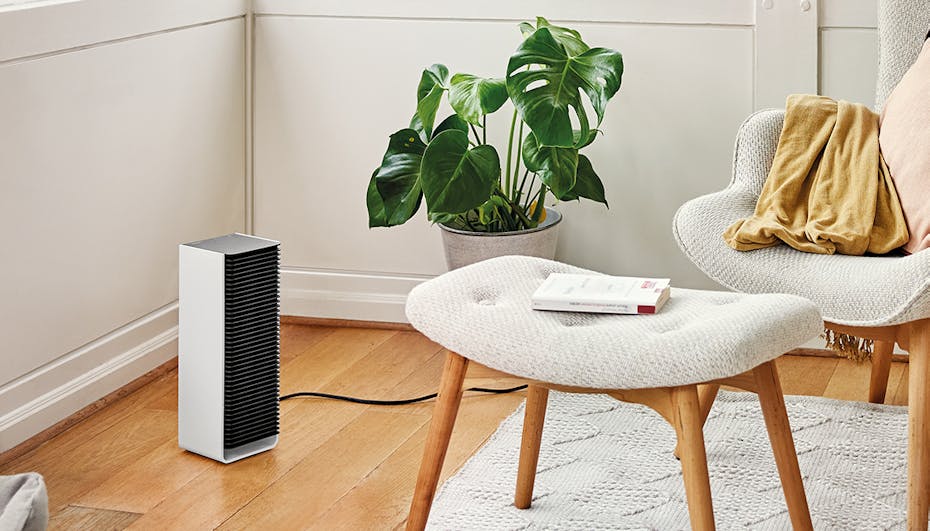 Sam little fan heater by Stadler Form in a bright livingroom environment