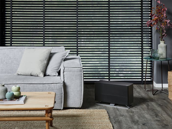 Oskar big humidifier by Stadler Form in black Oskar big humidifier by Stadler Form in black next to a couch in a living room
