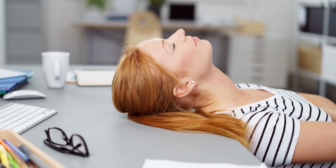 Woman sleeping in office