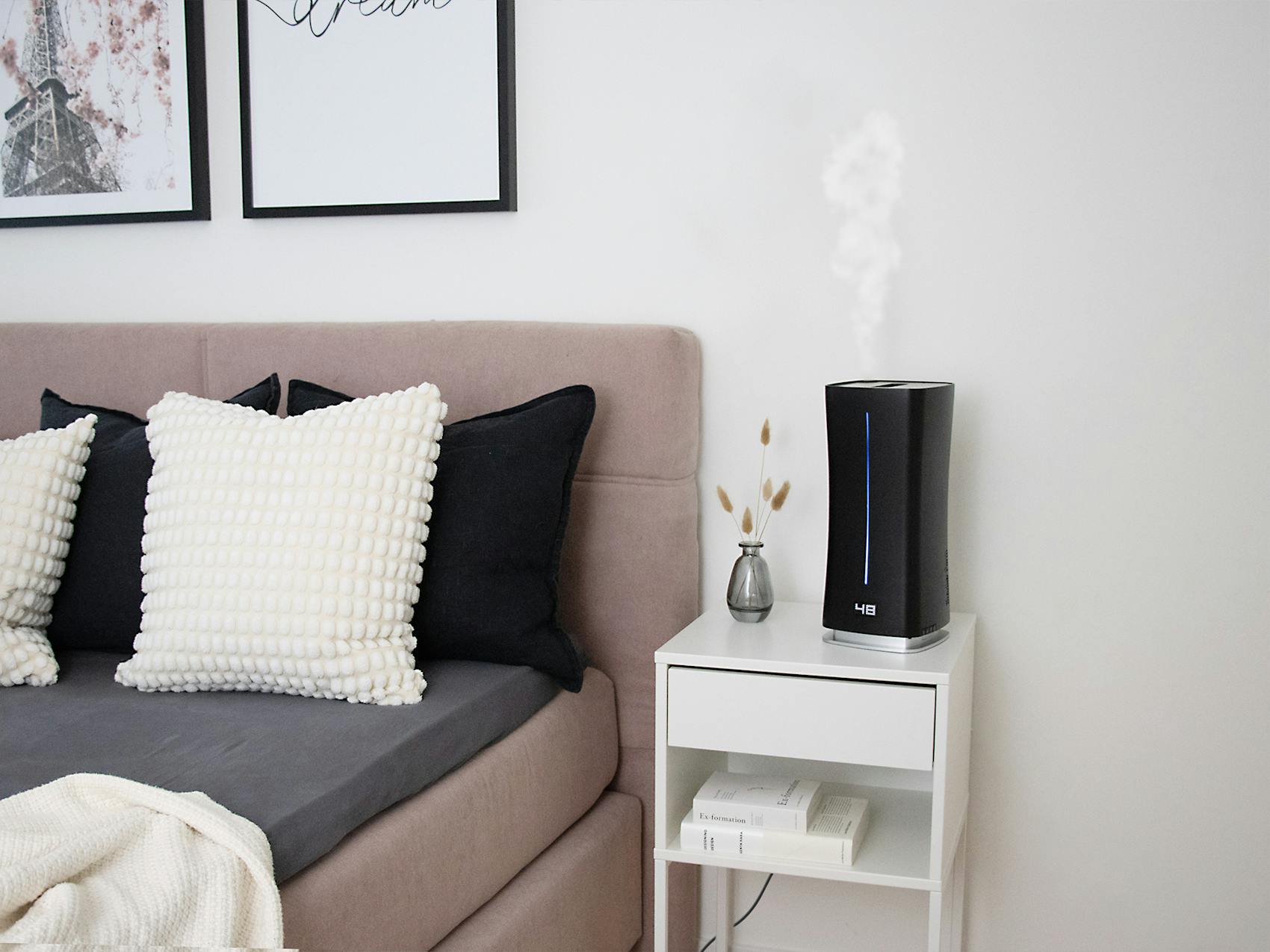 Eva little humidifier by Stadler Form in black Eva little humidifier by Stadler Form in black in a bedroom