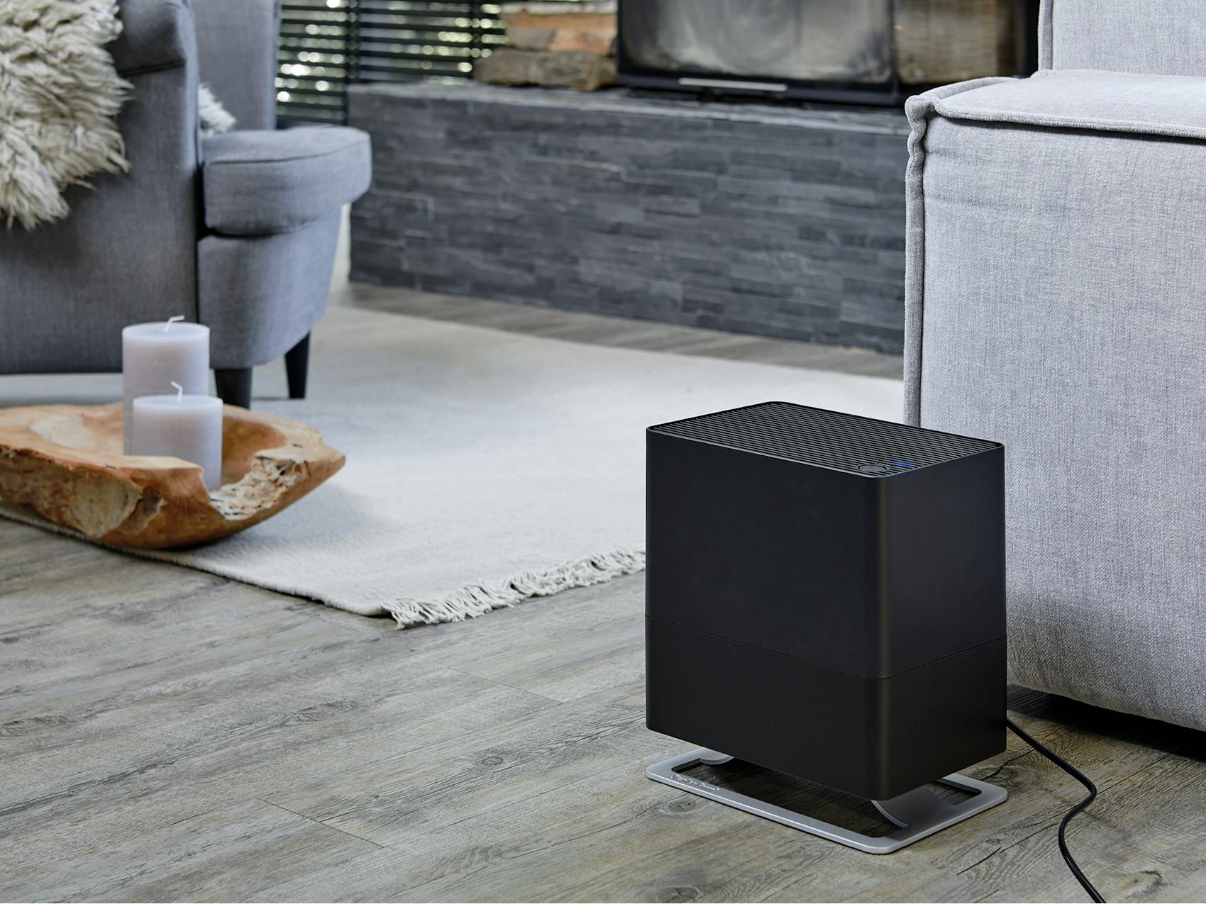 Oskar little humidifier by Stadler Form in black Oskar little humidifier by Stadler Form in black in a living room